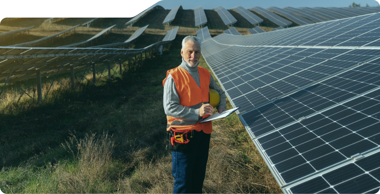 Solar professional inspecting panels at a solar farm